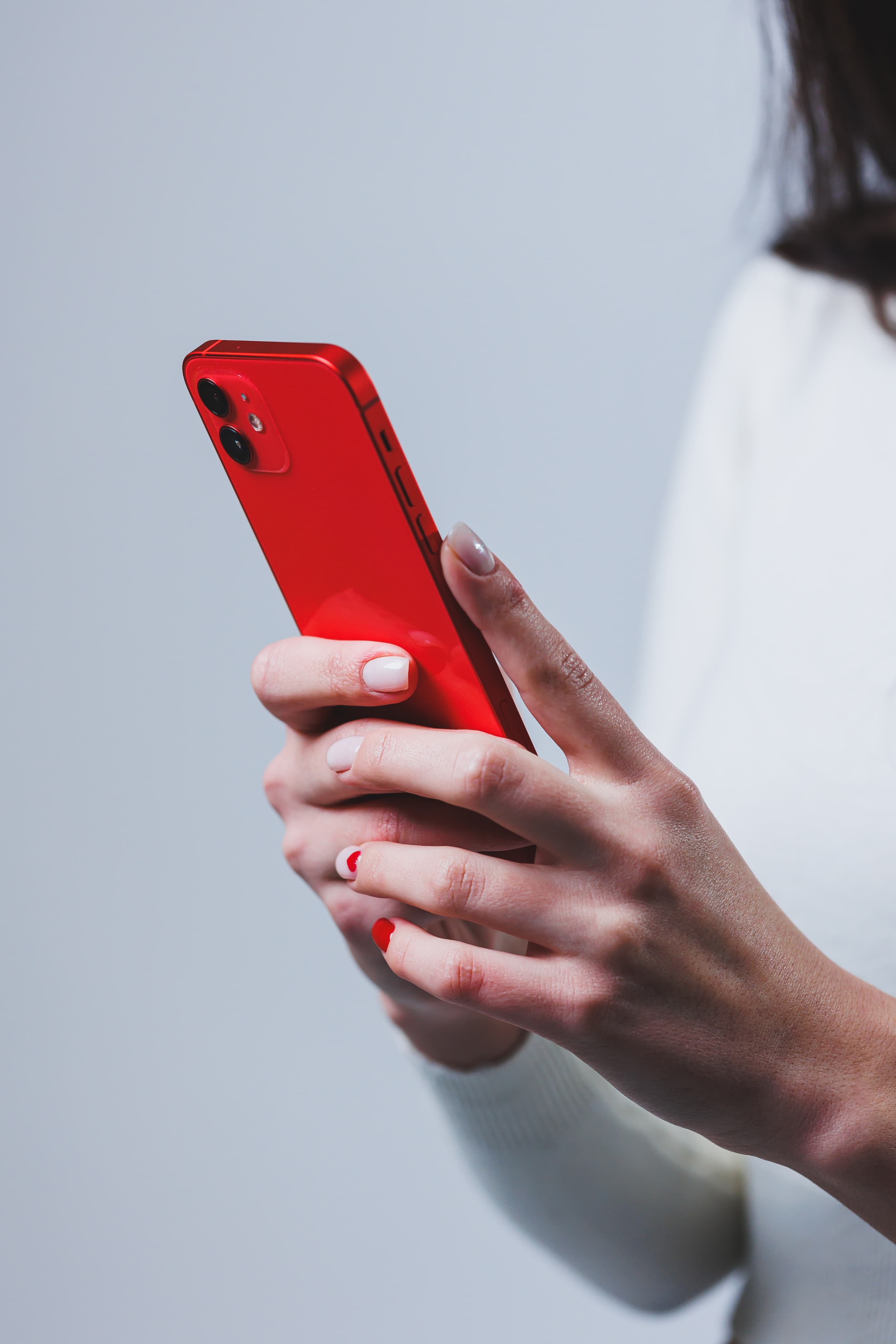 Hand holding phone with TikTok